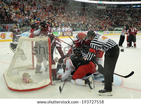 MINSK, BELARUS - MAY 19: Players of Belarus and Latvia fight during 2014 IIHF World Ice Hockey Championship match on May 19, 2014 in Minsk, Belarus.