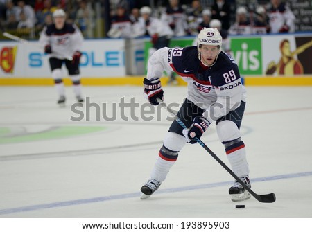 MINSK, BELARUS - MAY 20: ABDELKADER Justin of USA skates with the puck during 2014 IIHF World Ice Hockey Championship match on May 20, 2014 in Minsk, Belarus
