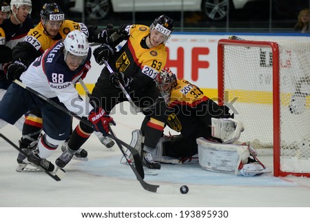 MINSK, BELARUS - MAY 20: MUELLER Peter of USA and WEISS Alexander of Germany battle for the puck during 2014 IIHF World Ice Hockey Championship match on May 20, 2014 in Minsk, Belarus