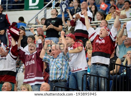 MINSK, BELARUS - MAY 20: Fans of Latvia celebrates during 2014 IIHF World Ice Hockey Championship match on May 20, 2014 in Minsk, Belarus