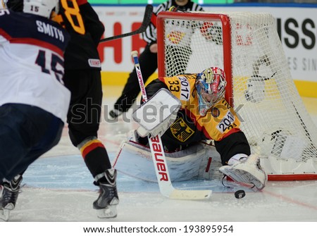 MINSK, BELARUS - MAY 20: AUS den BIRKEN Danny of Germany saves the puck during 2014 IIHF World Ice Hockey Championship match on May 20, 2014 in Minsk, Belarus