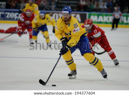 MINSK, BELARUS - MAY 22: AXELSSON Dick of Sweden skates with the puck during 2014 IIHF World Ice Hockey Championship quarterfinal match on May 22, 2014 in Minsk, Belarus.