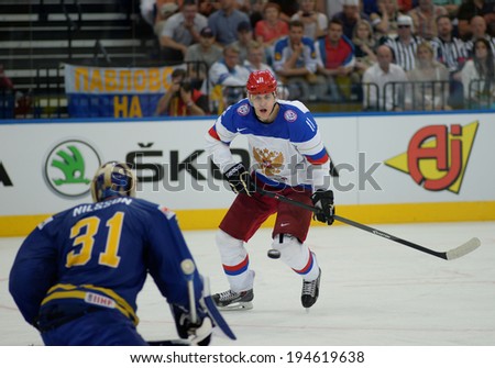 MINSK, BELARUS - MAY 24: MALKIN Yevgeni (11) of Russia shoot the puck during 2014 IIHF World Ice Hockey Championship semifinal match at Minsk Arena on May 24, 2014 in Minsk, Belarus.