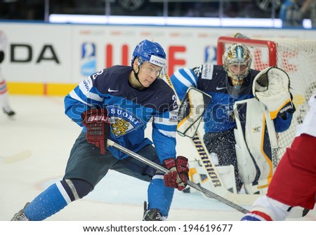 MINSK, BELARUS - MAY 24: MARTTINEN Jyri (28) of Finland skates up the ice during 2014 IIHF World Ice Hockey Championship semifinal match at Minsk Arena on May 24, 2014 in Minsk, Belarus.