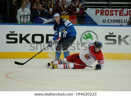 MINSK, BELARUS - MAY 24: PALOLA Olli (34) of Finland and ZAMORSKY Petr(3) of Czech Republic during 2014 IIHF World Ice Hockey Championship semifinal match at on May 24, 2014 in Minsk, Belarus.