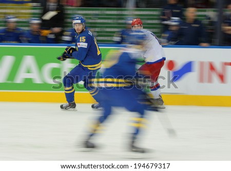 MINSK, BELARUS - MAY 24: SJOGREN Mattias(15) of Sweden skates up the ice during 2014 IIHF World Ice Hockey Championship semifinal match at Minsk Arena on May 24, 2014 in Minsk, Belarus.
