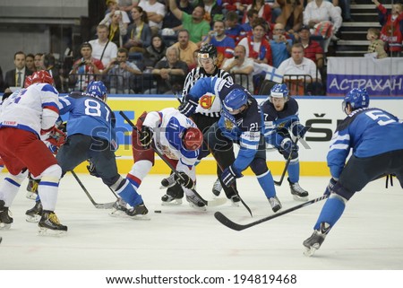 MINSK, BELARUS - MAY 25: MALKIN Yevgeni (11) of Russia and LEHTERA Jori (21) of Finland battle for the puck during 2014 IIHF World Ice Hockey Championship final at Minsk Arena