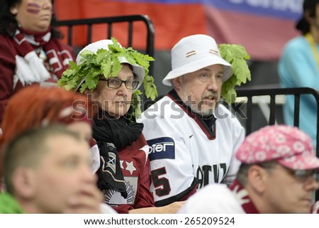 MINSK, BELARUS - MAY 17: Fans of Latvia during 2014 IIHF World Ice Hockey Championship match at Minsk Arena on May 17, 2014 in Minsk, Belarus.