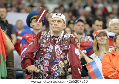 MINSK, BELARUS - MAY 17: Fan of Latvia during 2014 IIHF World Ice Hockey Championship match at Minsk Arena on May 17, 2014 in Minsk, Belarus.