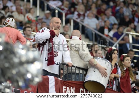 MINSK, BELARUS - MAY 20: Fans of Latvia during 2014 IIHF World Ice Hockey Championship match at Minsk Arena on May 20, 2014 in Minsk, Belarus.