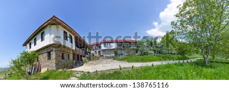 Monastery and old church complex in the mountain landscape PANORAMA
