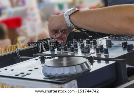 beach bar,typical summer scene of beach party and dj mixette and equipment in focus
