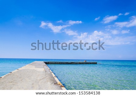 Silent Place, jetty at bright vibrant sky and sea water horizon
