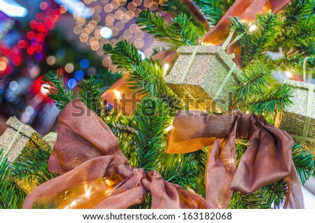 Image of luxury New Year gifts, present boxes under Christmas tree in holiday eve, Christmastime celebration, home decorated with festive shiny lights, magic x-mas night