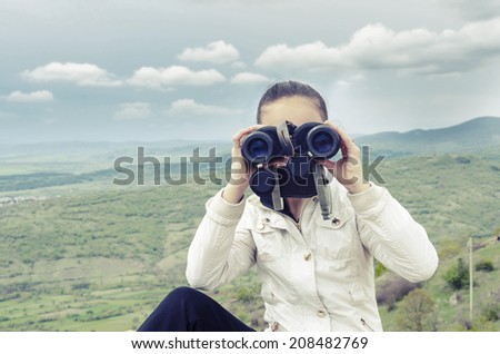 Concept of exploration with girl and binoculars, VINTAGE