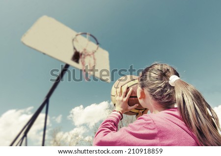 beautiful girl shooting basket and playing basketball, lower view wide angle, VINTAGE