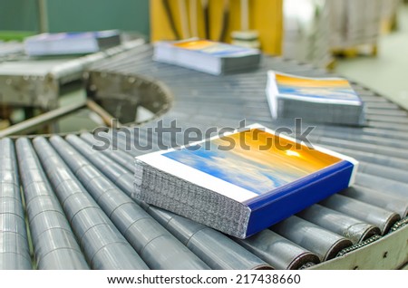Book, magazine,  production line into press plant house. Automatic assembly line.