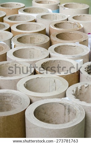 Cylinders cardboard background of Rolled paper in offset printing house, vertical