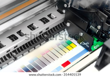 Working industrial large format UV inkjet printer ploter for printing on big sheets of plastic or billboards isolated over white