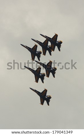 VIRGINIA BEACH, VA - MAY 17:US Navy Blue Angels in F-18 Hornet planes perform in air show routine in Va beach, VA on May 17, 2010. Blue Angels are the oldest active aerobatic team in the world
