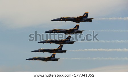 VIRGINIA BEACH, VA - MAY 17:US Navy Blue Angels in F-18 Hornet planes perform in air show routine in Va beach, VA on May 17, 2010. Blue Angels are the oldest active aerobatic team in the world