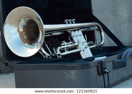 Silver trumpet in the black box