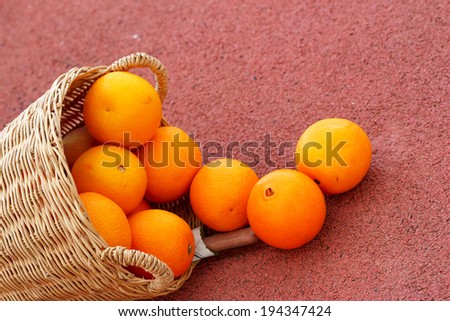 orange fruits in wicker basket