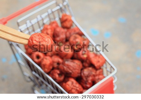 Red jujube in mini shopping cart super market