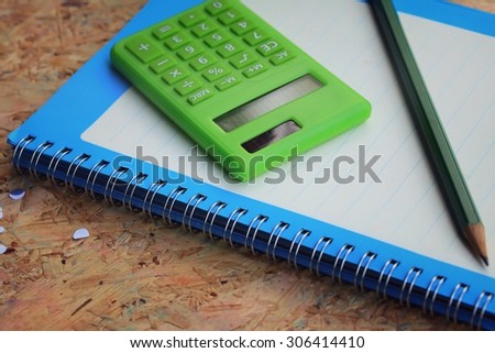 Mix book and calculator, stapler, tape, paper punch, pencil, scissors for office