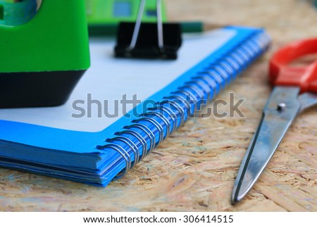 Mix book and calculator, stapler, tape, paper punch, pencil, scissors for office