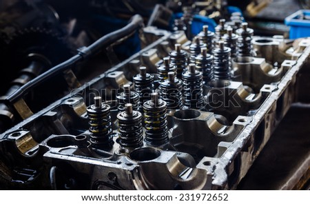 Open engine block exposing the interior parts and springs