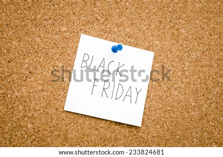 Black friday note reminder pinned to a pin board so as to remember to make plans for the big sale