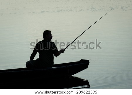 Fisherman in Boat on a Twilight Lake