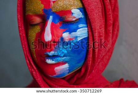 portrait of a woman completely covered with thick paint