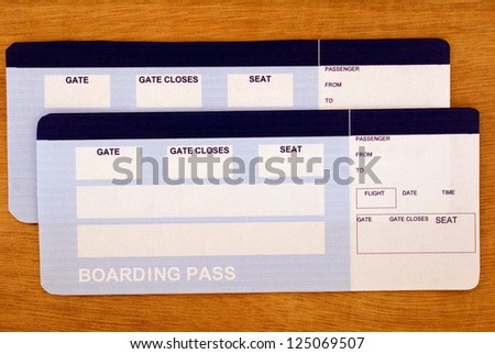 Fake flight tickets with empty spaces for your text on the table. Ready to go?