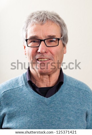 Plain Close Up Portrait of a Senior European man with Caucasian background