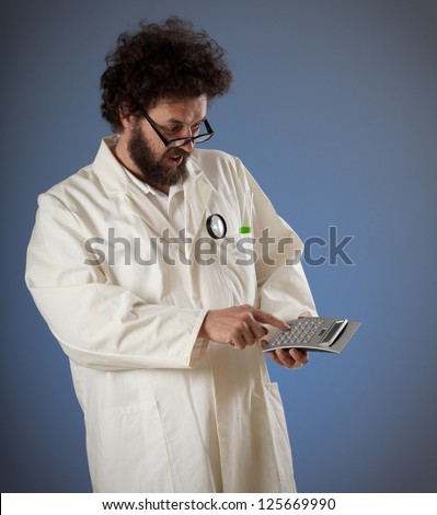 Scientist with weird hair and beard looking confused on his calculator while typing something.