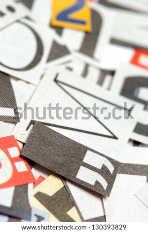 Background of many different letters, cut out from news papers and magazines. Deliberate shallow focus in the center.