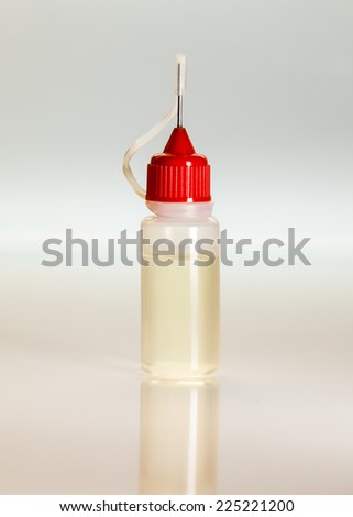 Small plastic bottle for samples of liquids, filled with yellowish liquid. Concept for medical or doping doping test with urine.