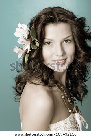 Sexy fashion portrait with flowers .Portrait of beautiful girl with flowers in her hair