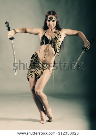 young warrior woman holding sword in her hand