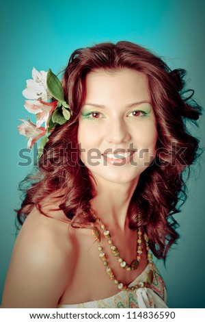 Sexy fashion portrait with flowers .Portrait of beautiful girl with flowers in her hair