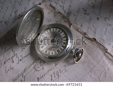Old-time watch,current of time,handwritten documents,history