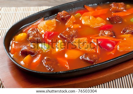 chinese cuisine .pork with tart sweet sauce,pineapple and pepper