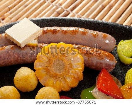 Japanese cuisine .Sausage making roasted with vegetable