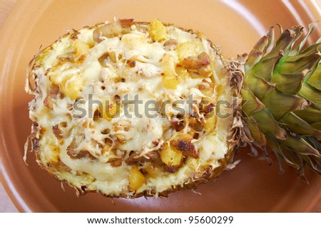 roast meat with cheese  grilled  in pineapple .closeup
