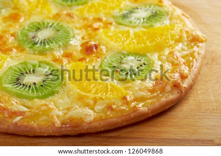 homemade sweet pizza with fruit.with orang kiwi,sauce