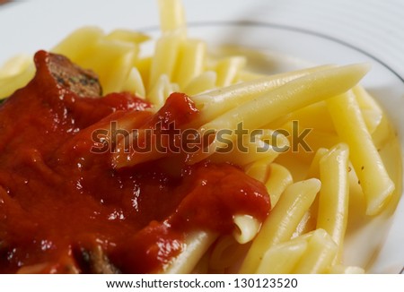 pasta with tomato beef sauce  on wooden table