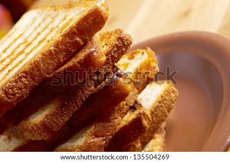 pile  toasted bread slices for breakfast.Close up of toasted white bread in slices
