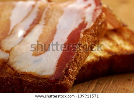 pile  toasted bread slices for bacon.Close up of toasted white bread in slices